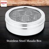 Montavo by FnS stainless steel round masala box with transparent lid, 7 spice containers and spoon for organized storage.