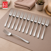 Montavo by FnS Flair 12 Pcs stainless steel dinner fork set arranged on a premium table mat with sleek mirror finish.