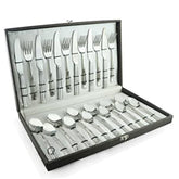 Complete FNS stainless steel 24-piece cutlery set neatly arranged in a black presentation gift box.