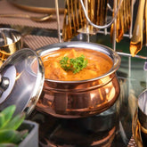 FnS Relish Small Copper Finish Stainless Steel Handi with lid serving curry on a premium dining table.