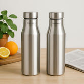 Montavo by FnS Aqua 1 litre stainless steel water bottle set of 2 on a wooden table with plant and oranges