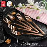 FnS Sorrento Rose Gold 6 Pc dessert fork set by Chef Vicky Ratnani, featuring textured handles arranged on a black plate.