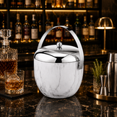 FnS Double walled Apple Ice Bucket in marble finish with stainless steel lid and handle displayed in a premium home bar.