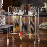 FnS Kenwood 18-piece 24-karat gold-plated cutlery set with decorative handles shown on a hanging stand on a wooden table.