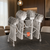 FnS Rhombo 24-piece stainless steel cutlery set with textured handles and hanging stand on a luxury charcoal marble table.