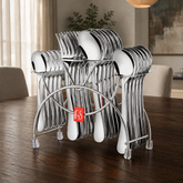 FnS Victoria 24-piece stainless steel cutlery set with hanging stand and red FnS badge on a luxury dark wood dining table.