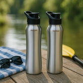 Montavo by FnS Reptide 1 litre stainless steel water bottle set of 2 with black caps displayed outdoors on a wooden table