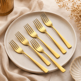 Montavo by FnS Alexa Gold Stainless Steel 6 Pcs Dinner Fork Set on the plate with table and premium background.