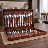 Montavo by FnS Creta 24 Pc stainless steel cutlery set neatly displayed in an open leatherette box on a wooden dining table