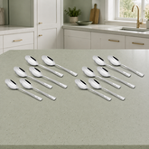 Montavo by FnS Creta 12-piece baby spoon set displayed on a pale sage kitchen counter in a clean bright premium setting.