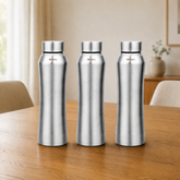 Montavo by FnS Oasis 750 ml stainless steel water bottle set of 3 with silver caps displayed on a wooden dining table