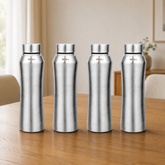 Montavo by FnS Oasis 750 ml stainless steel water bottle set of 4 with silver caps displayed on a wooden dining table