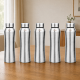 Montavo by FnS Oasis 750 ml stainless steel water bottle set of 5 with silver caps displayed on a wooden dining table