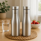 Montavo by FnS Purify 750 ml stainless steel water bottle set of 2 displayed on a woven mat in a warm modern kitchen