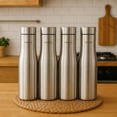 Montavo by FnS Purify 750 ml stainless steel water bottle set of 4 displayed on a woven mat in a warm modern kitchen