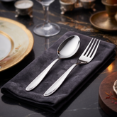 Montavo by FnS Sober 12 Pc premium stainless steel cutlery set with polished spoon and fork styled on a luxury dining table