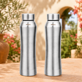 Montavo by FnS Oasis 1 litre stainless steel water bottle set of 2 with silver caps displayed on a sunlit garden table.