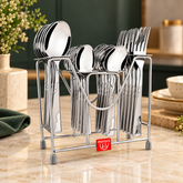 Montavo Creta 24-piece Stainless Steel Cutlery Set with Stand, featuring dinner spoons, forks, baby spoons and teaspoons in mirror finish.