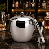 FnS stainless steel Apple Ice Bucket with Ice Tong in a premium home bar setting with polished mirror finish and lid.