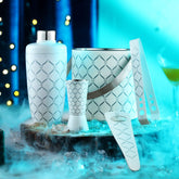 FNS 5-piece white bar tool set with dramatic blue lighting and ice display for cocktail preparation