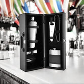 FNS Cheers Mini Cabinet 7-piece bar set displayed open on bar with colorful striped decor background