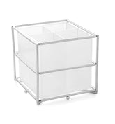 Minimalist square cutlery holder with four compartments, transparent sides, and metal frame on white background.