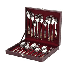 Complete flatware set neatly arranged in a maroon velvet-lined box, isolated on plain white background.