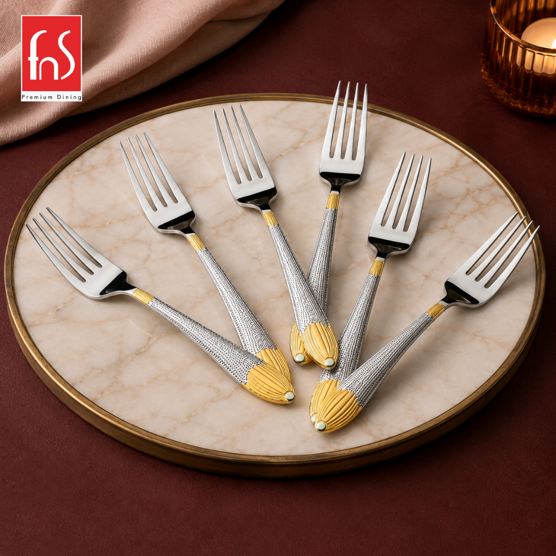 Montavo by FnS Passion 6-piece dinner fork set with real gold-plated accents displayed on a round elegant marble tray.
