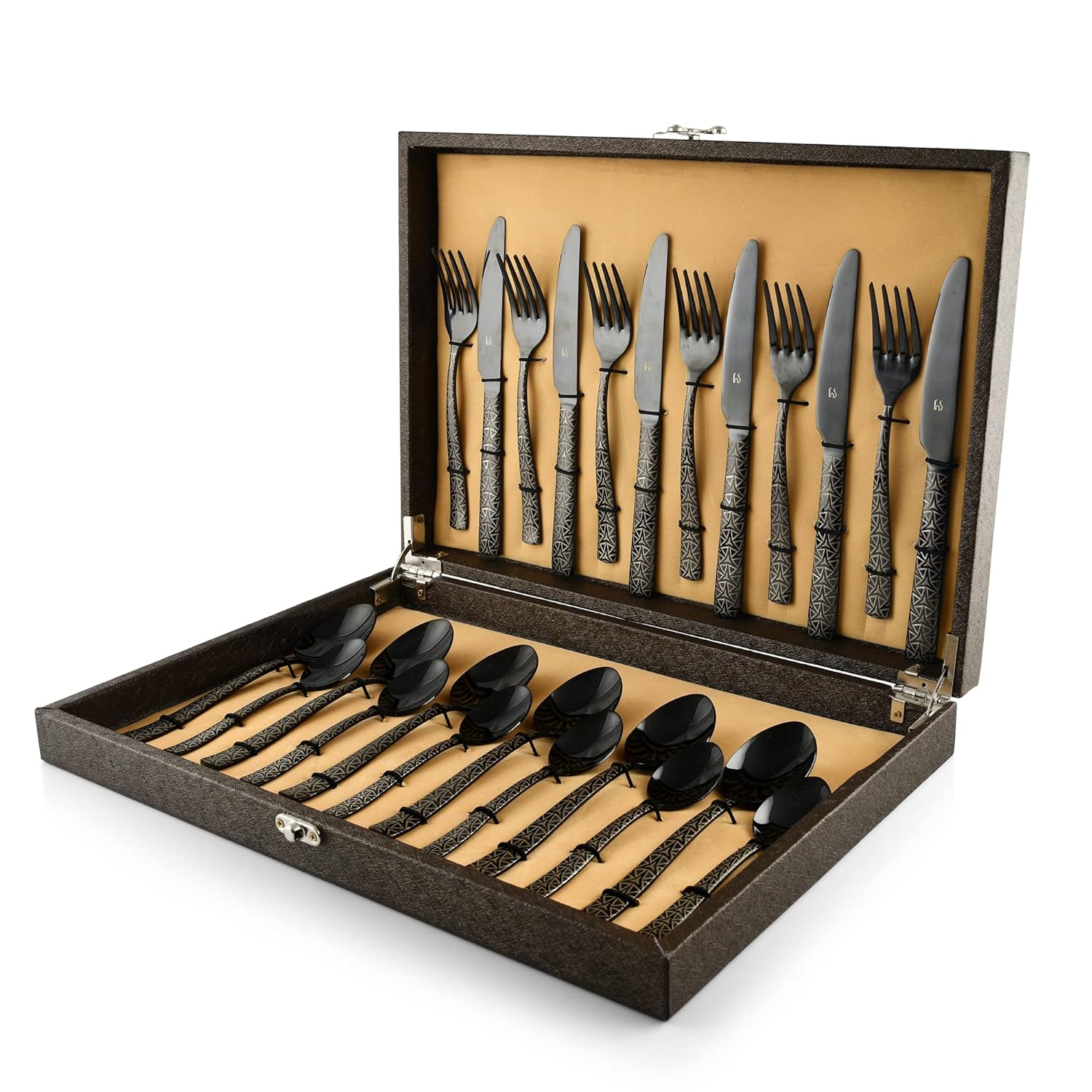 Luxury black cutlery set with patterned handles neatly arranged in an open presentation box with gold lining.