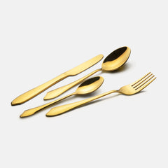 Elegant four-piece golden flatware set including knife, fork, tablespoon, and teaspoon on plain white background.