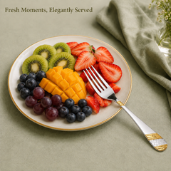 FnS Imperio Fruit Fork from a set of 6 pcs resting on a plate of sliced kiwi, strawberries, mango, grapes and blueberries.