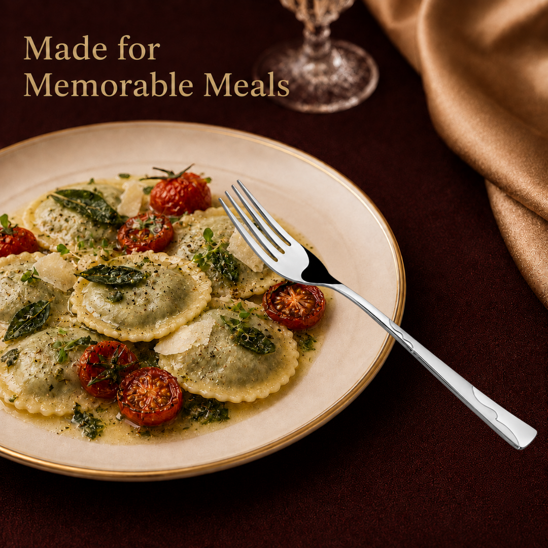 Montavo by FnS Creta stainless steel dinner fork with wavy handle served beside ravioli and roasted tomatoes on a plate.
