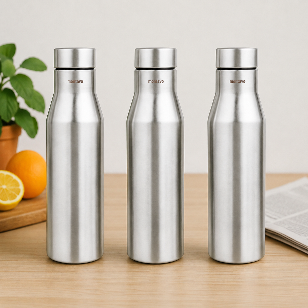 Montavo by FnS Aqua 1 litre stainless steel water bottle set of 3 on a wooden table with plant and oranges