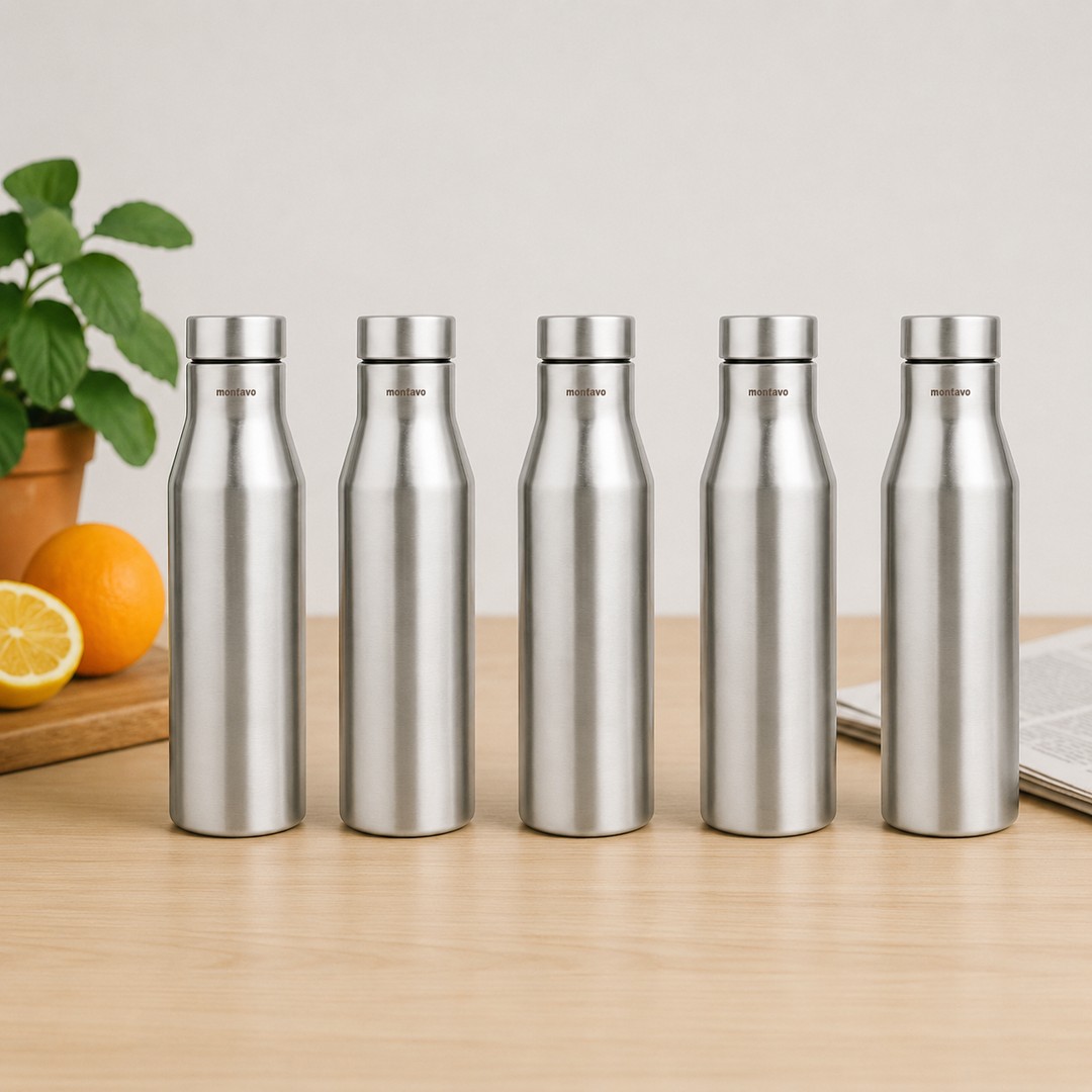 Montavo by FnS Aqua 1 litre stainless steel water bottle set of 5 on a wooden table with plant and oranges