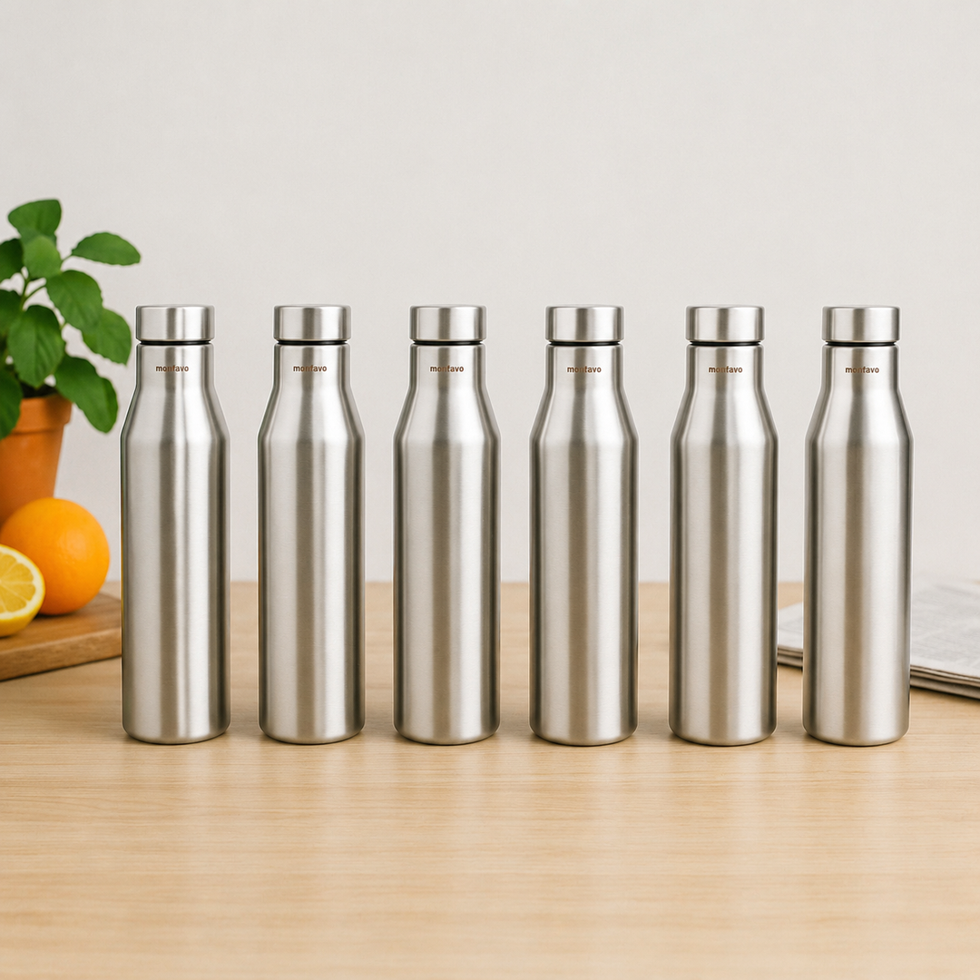 Montavo by FnS Aqua 1 litre stainless steel water bottle set of 6 on a wooden table with plant and oranges