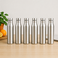 Montavo by FnS Aqua 1 litre stainless steel water bottle set of 6 on a wooden table with plant and oranges