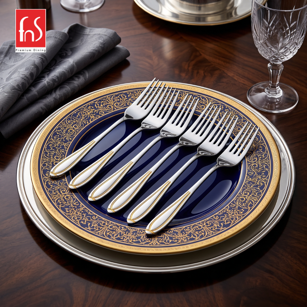 FnS Classic 24 Karat gold plated stainless steel dinner fork set of 6 displayed on a premium blue and gold dining plate