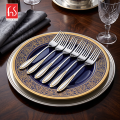 FnS Classic 24 Karat gold plated stainless steel dinner fork set of 6 displayed on a premium blue and gold dining plate