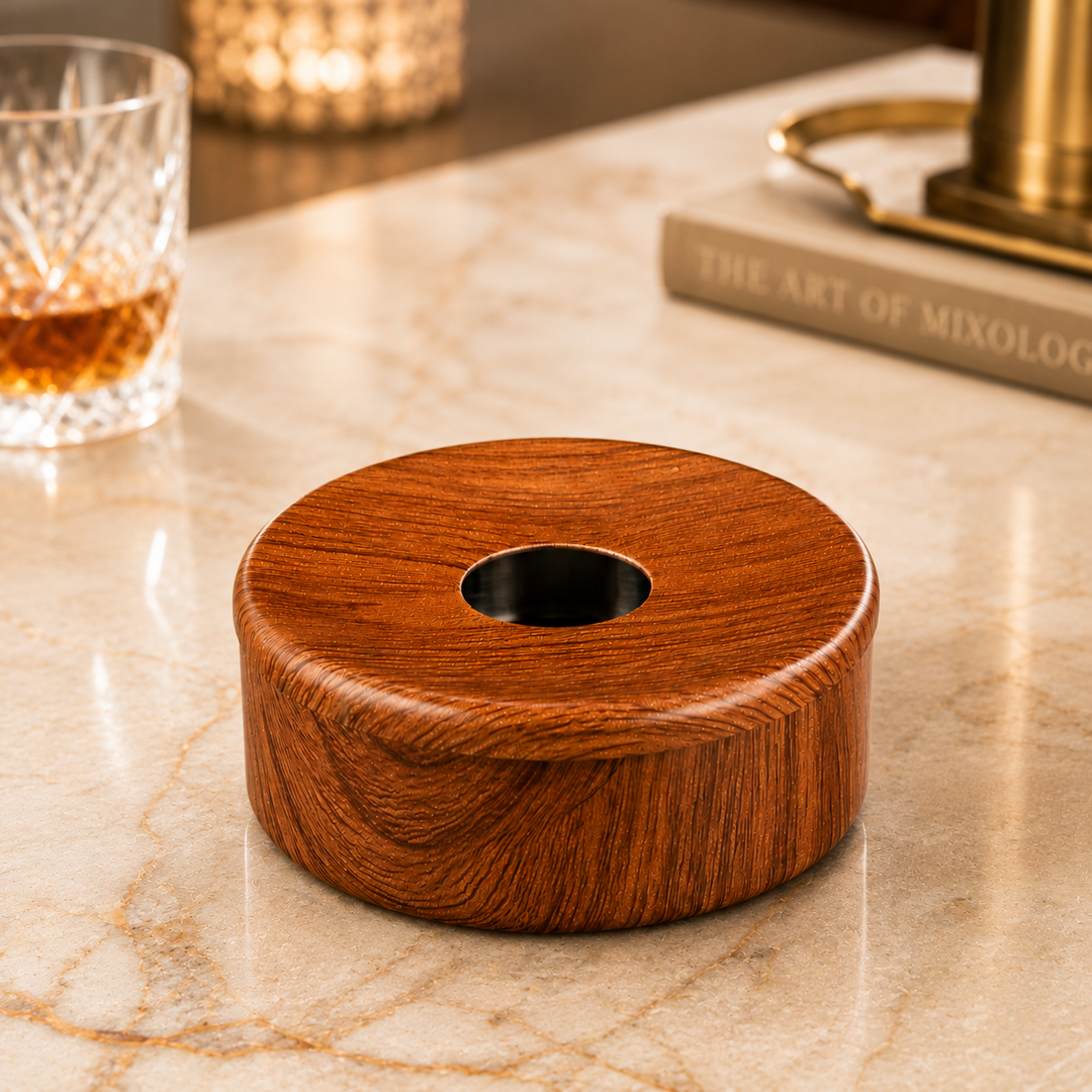 FnS Matto Wooden Finish Steel Ashtray with Lid, round wood-grain design and Centre opening, displayed on a marble counter.