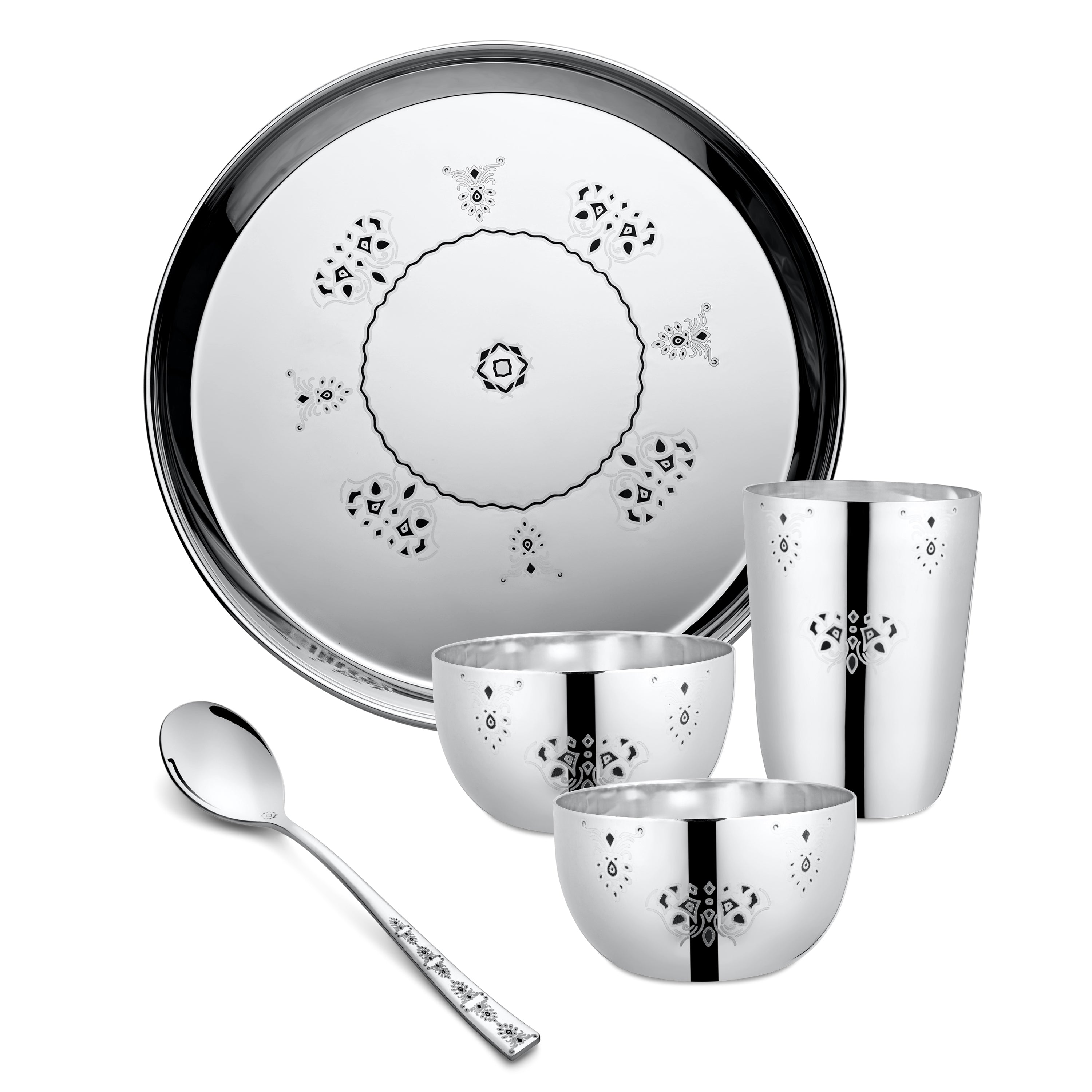 Stainless steel dinnerware set with traditional Indian design featuring a large round plate with geometric mandala patterns, two small bowls, one tall glass, and a decorative spoon with etched detailing on its handle
