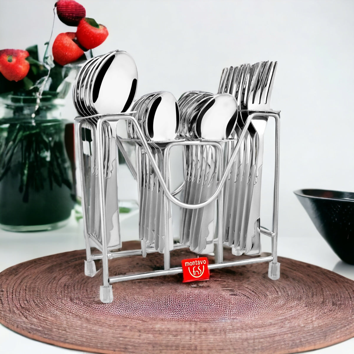 Montavo Creta 24-piece Stainless Steel Cutlery Set with Stand, featuring dinner spoons, forks, baby spoons and teaspoons in mirror finish.
