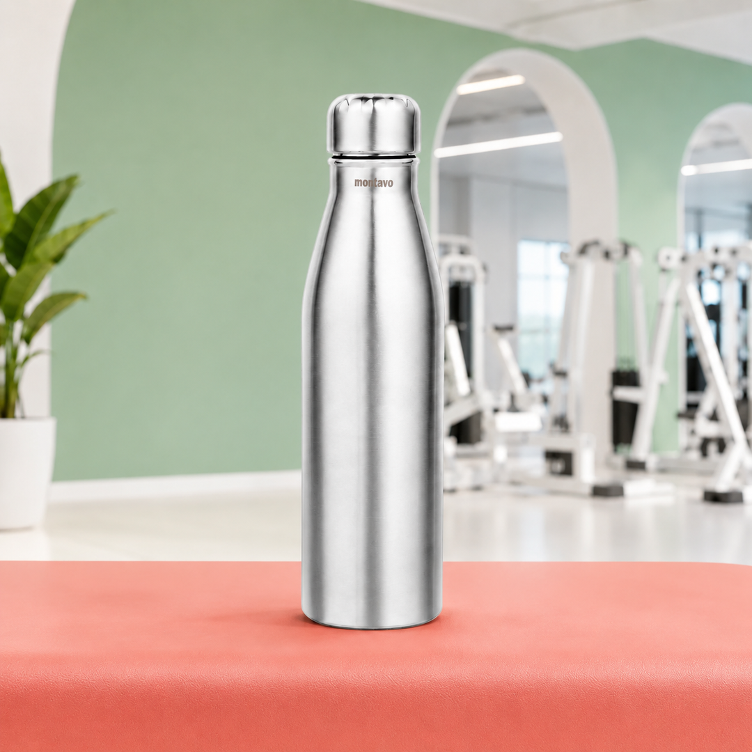Montavo by FnS Bliss 1 Litre stainless steel water bottle with silver caps displayed on a coral gym bench