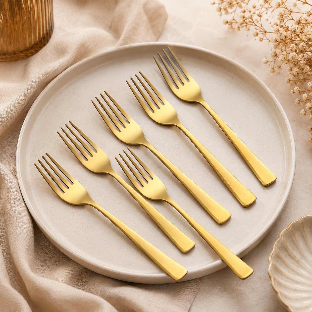 Montavo by FnS Alexa Gold Stainless Steel 6 Pcs Dinner Fork Set on the plate with table and premium background.