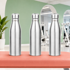 Montavo by FnS Bliss 750 ml stainless steel water bottle set of 3 with silver finish displayed on a gym bench.
