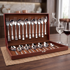 Montavo by FnS Creta 24 Pc stainless steel cutlery set neatly displayed in an open leatherette box on a wooden dining table