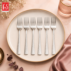 Montavo by FnS Helios stainless steel 6 Pcs Dinner Fork Set on table with plate with premium background