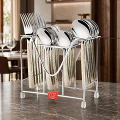 Montavo by FnS Pebble 24-piece laser-engraved cutlery set with hanging stand displayed on a luxury marble dining table.
