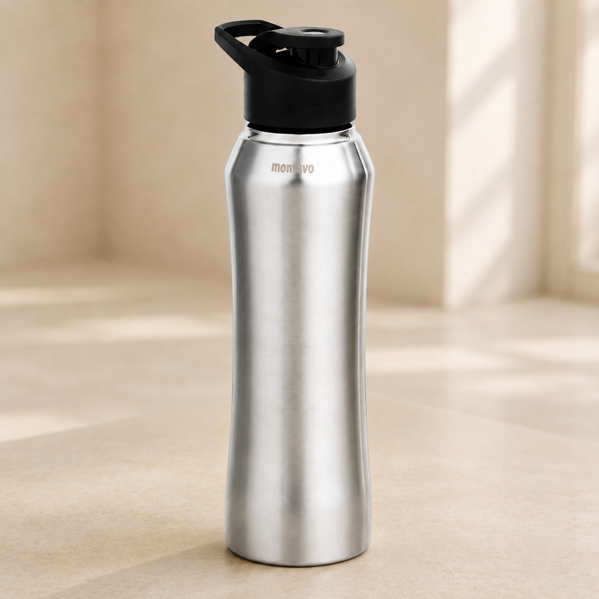 Montavo by FnS Riptide 1 litre stainless steel water bottle with sleek silver finish and black flip-top carry lid.
