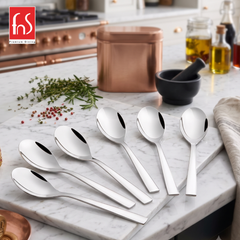 Montavo by FnS Trendz 6-Pc stainless steel dessert spoon set with sleek mirror finish displayed on a rustic wooden table.