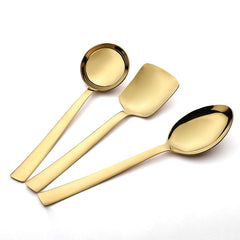 Alexa gold-plated serving spoon set with gravy ladle, rice server, and large serving spoon on white background